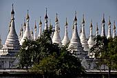 Myanmar - Mandalay, Sandamuni Pagoda. The entire ground is covered with 1749 small white pagodas with stone slabs with the Buddhist Tripitaka. 